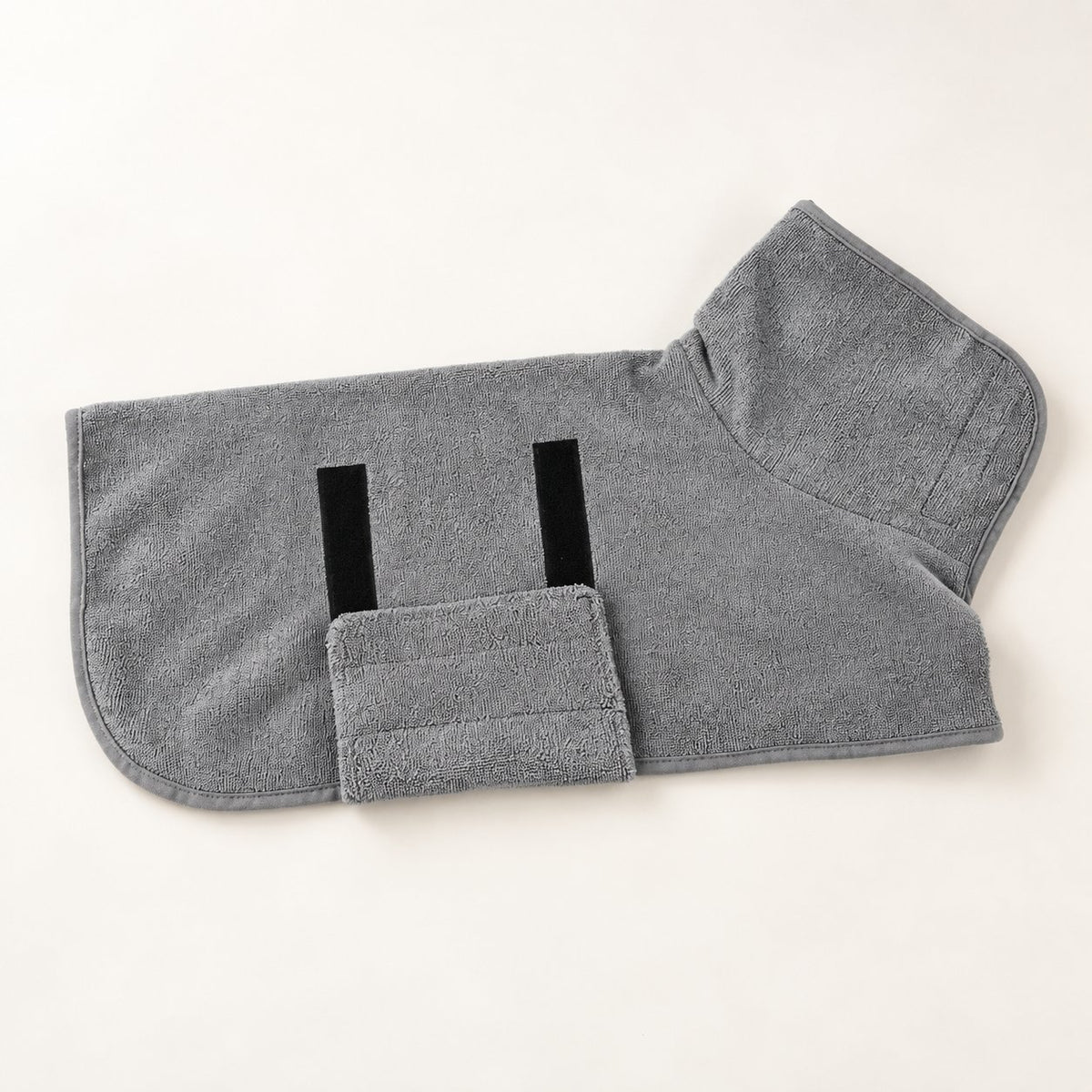 Grey bath robe laid flat, showing the fastenings